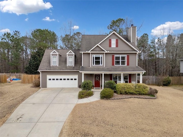 view of front of property with a garage and covered porch