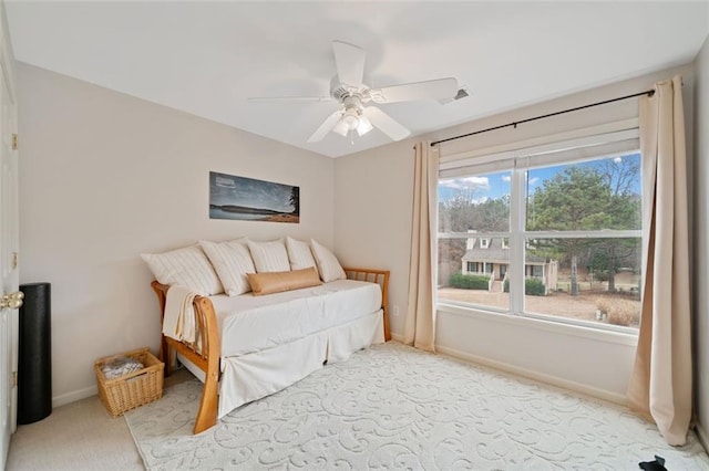 bedroom with light carpet and ceiling fan