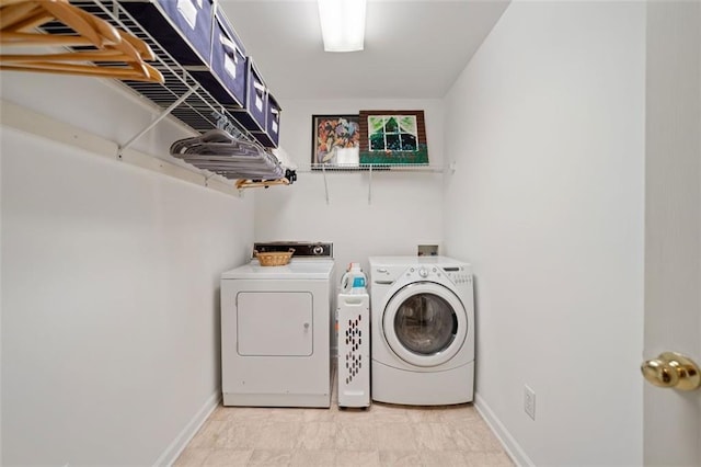 laundry area with independent washer and dryer