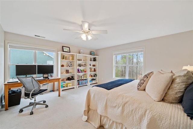 carpeted bedroom with ceiling fan