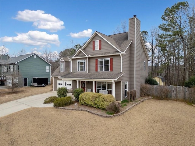 view of front facade featuring a porch and a garage