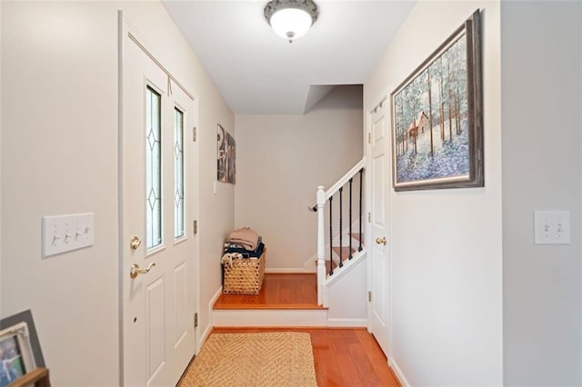 foyer entrance with light wood-type flooring