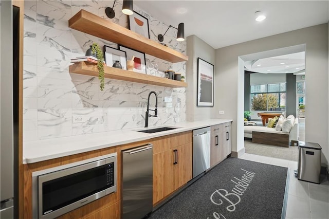 indoor wet bar with stainless steel appliances, backsplash, and recessed lighting