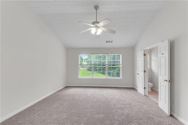 621 Kenridge Way Unit 0, Suwanee, GA 30024 - unfurnished bedroom featuring carpet floors, baseboards, lofted ceiling, ceiling fan, and ensuite bathroom