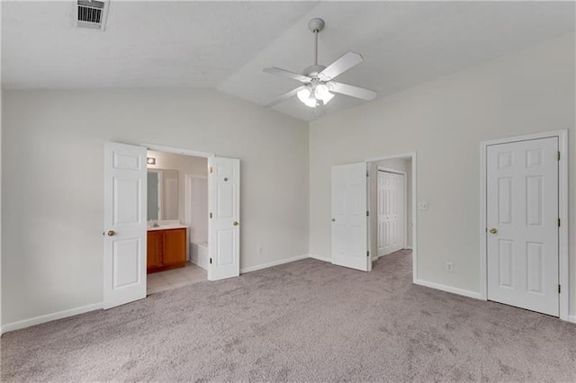 621 Kenridge Way Unit 0, Suwanee, GA 30024 - unfurnished bedroom with light colored carpet, baseboards, vaulted ceiling, connected bathroom, and ceiling fan