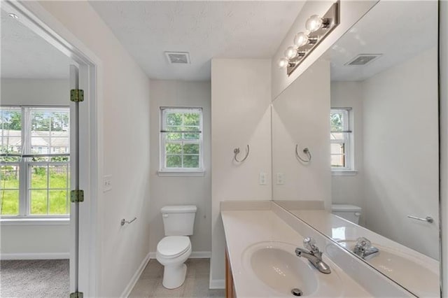621 Kenridge Way Unit 0, Suwanee, GA 30024 - bathroom featuring toilet, healthy amount of natural light, baseboards, and vanity