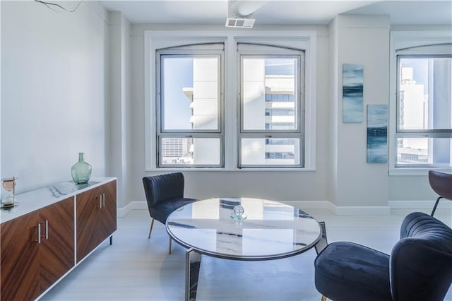 living area featuring visible vents and baseboards