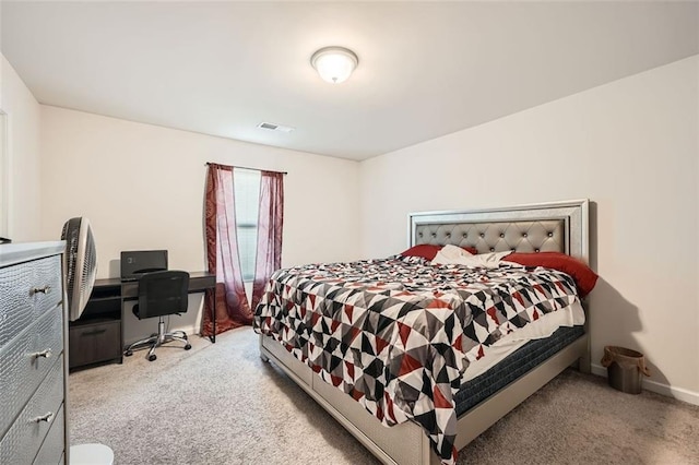 bedroom with visible vents, baseboards, and light colored carpet