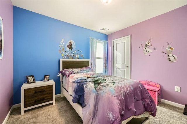 carpeted bedroom with visible vents and baseboards