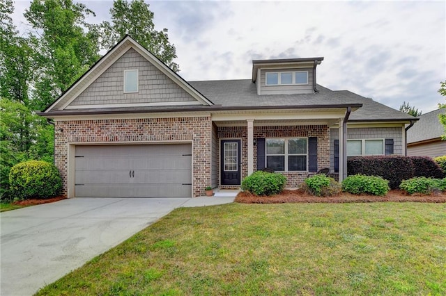 craftsman-style house featuring a front yard and a garage