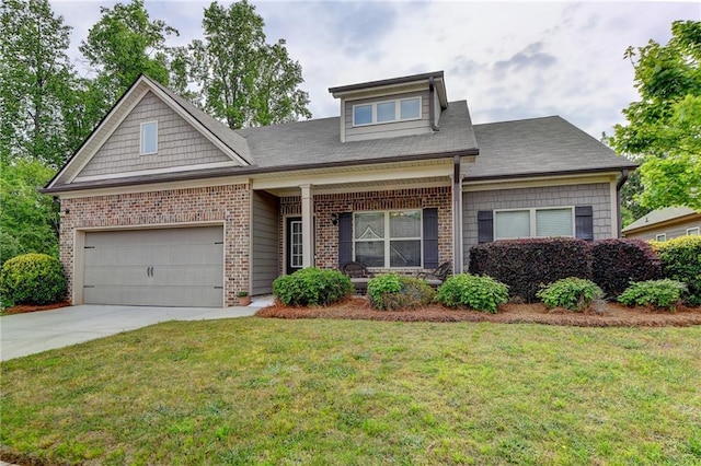 craftsman-style home with a front yard, brick siding, driveway, and an attached garage