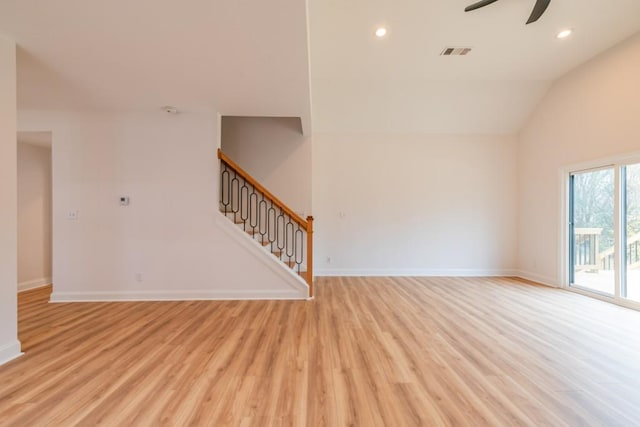 unfurnished living room featuring vaulted ceiling, ceiling fan, and light hardwood / wood-style flooring