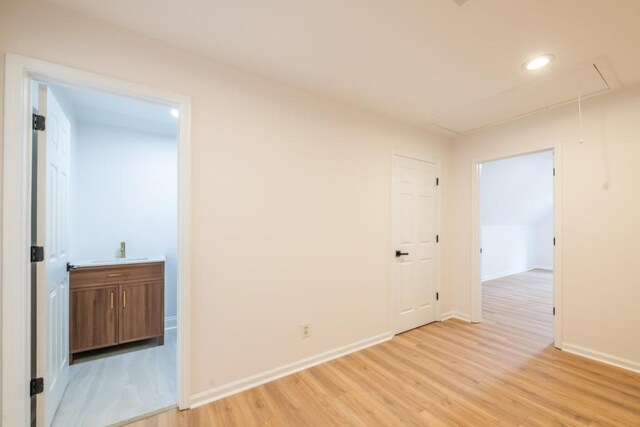 spare room with light wood-type flooring