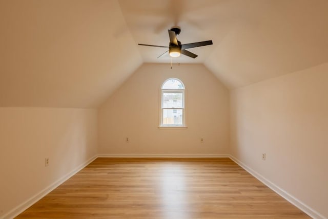 additional living space with ceiling fan, vaulted ceiling, and light hardwood / wood-style floors