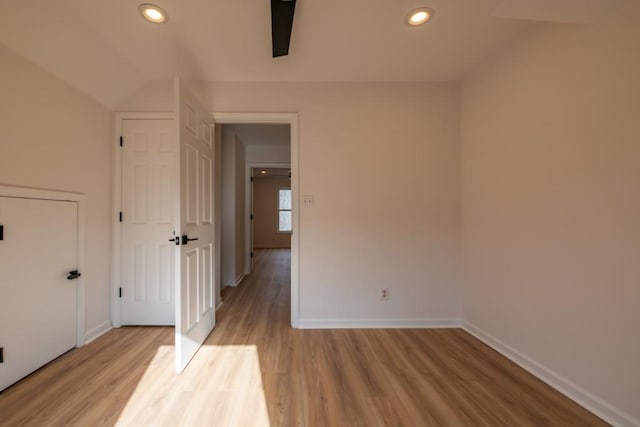 empty room with light hardwood / wood-style flooring