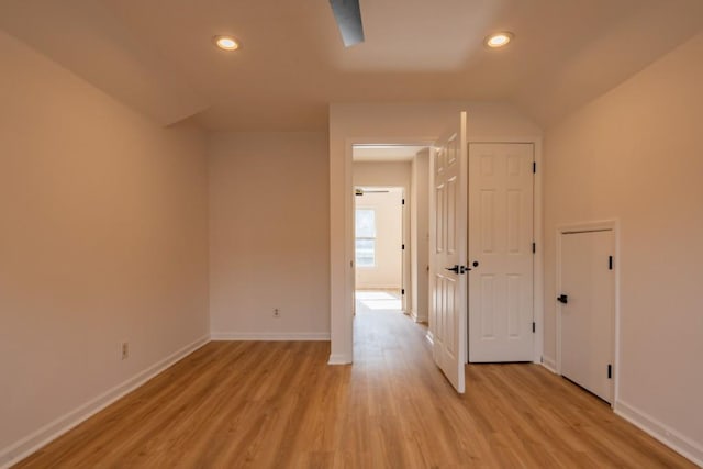 additional living space with light hardwood / wood-style floors