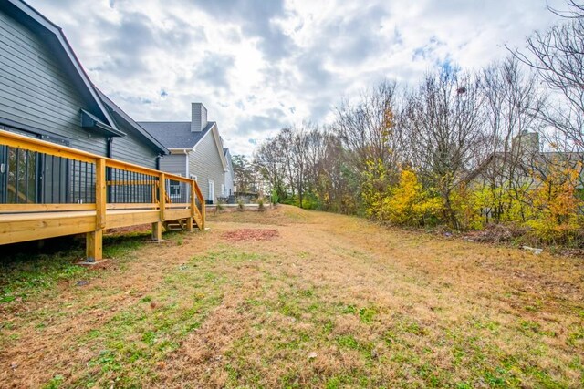 view of yard with a wooden deck