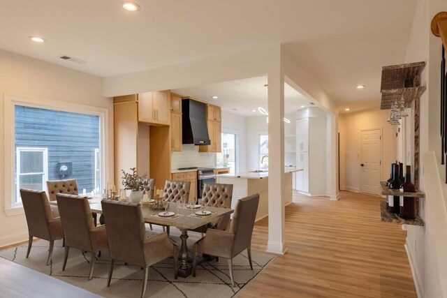 dining area with light wood-type flooring