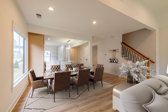 dining space featuring light hardwood / wood-style floors