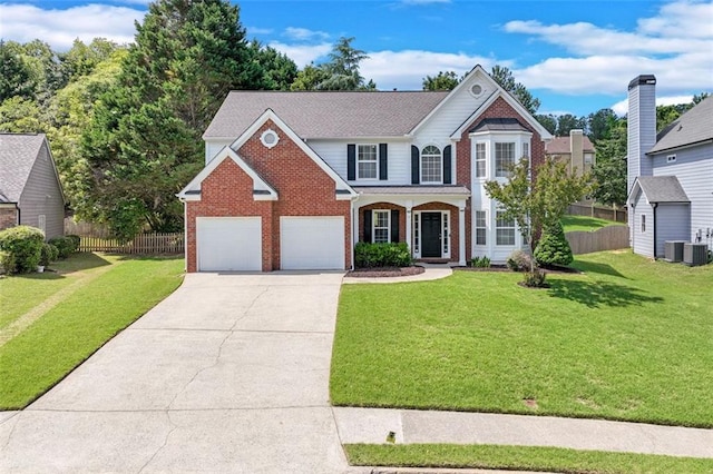 traditional-style house with brick siding, concrete driveway, and a garage