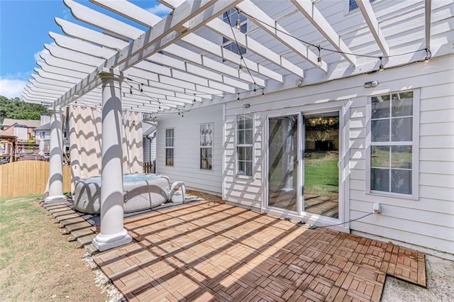 view of patio / terrace with a pergola and fence