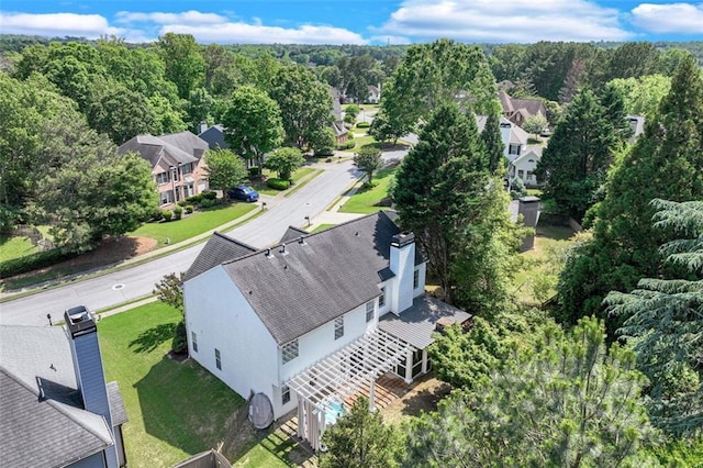 aerial view of residential area with a heavily wooded area
