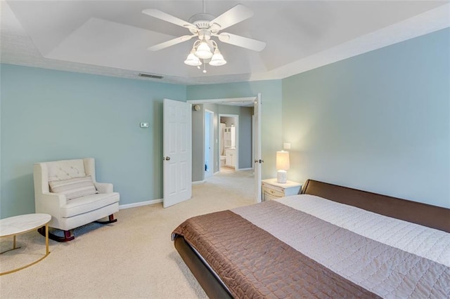 bedroom featuring carpet floors, baseboards, a ceiling fan, and a raised ceiling