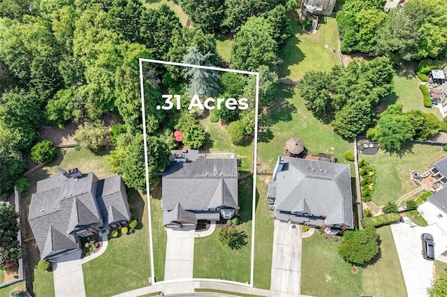 aerial view of property and surrounding area featuring property parcel outlined
