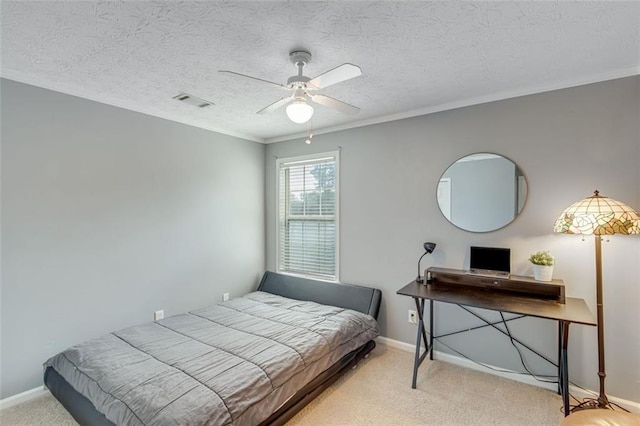 bedroom featuring carpet flooring, baseboards, ornamental molding, and a ceiling fan