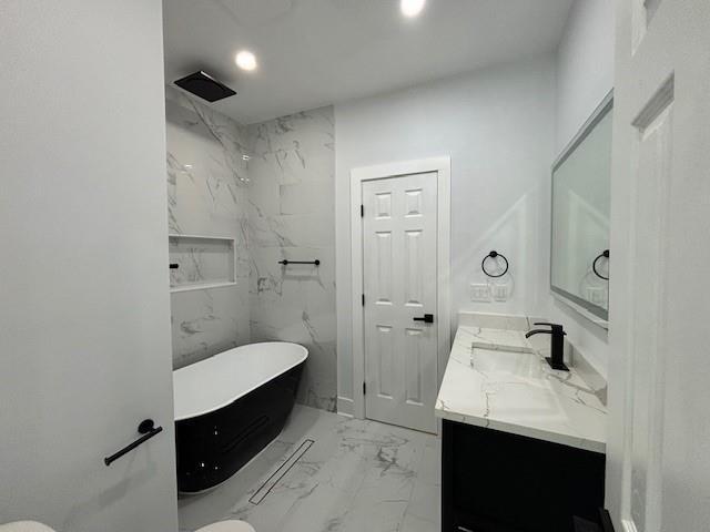 full bathroom featuring vanity, toilet, and plus walk in shower