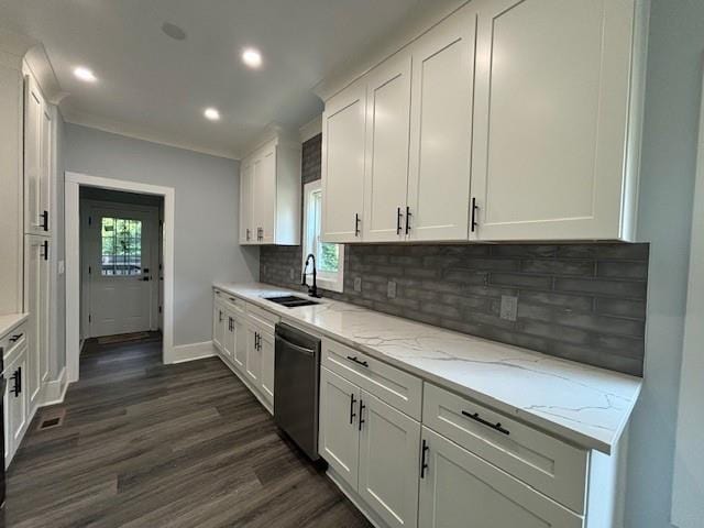 kitchen with dishwasher, white cabinetry, tasteful backsplash, a wealth of natural light, and light stone countertops