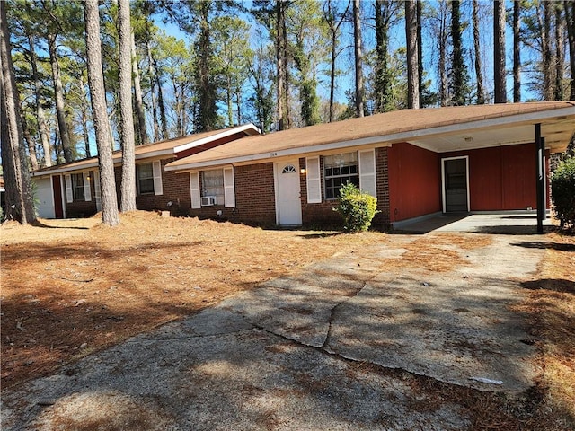 ranch-style home featuring a carport