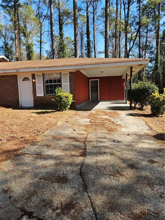 view of front of property with a carport