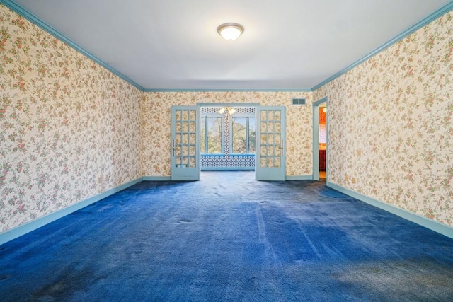 spare room featuring wallpapered walls and ornamental molding