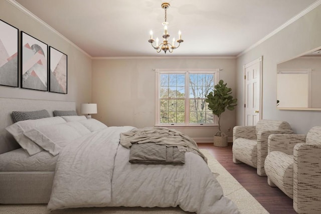 bedroom with crown molding, wood finished floors, baseboards, and a chandelier