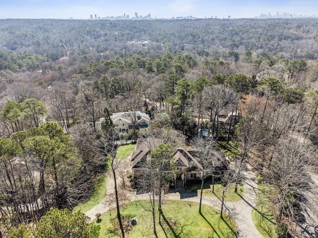 bird's eye view featuring a forest view