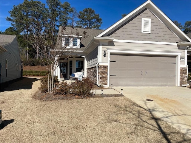 view of front of property with a garage and covered porch