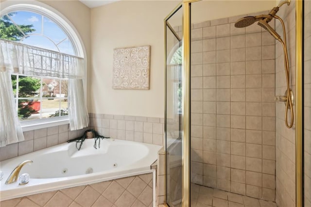 bathroom featuring a stall shower and a whirlpool tub