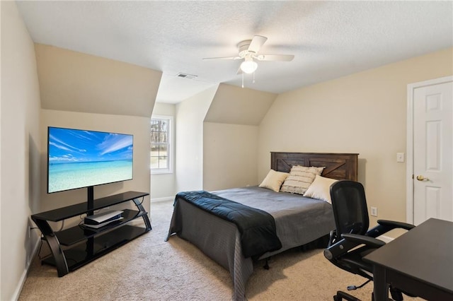 bedroom featuring carpet floors, visible vents, a textured ceiling, and lofted ceiling