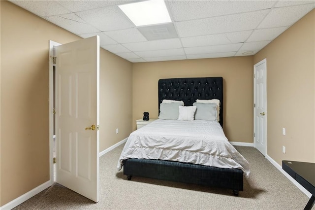 bedroom with carpet floors and baseboards