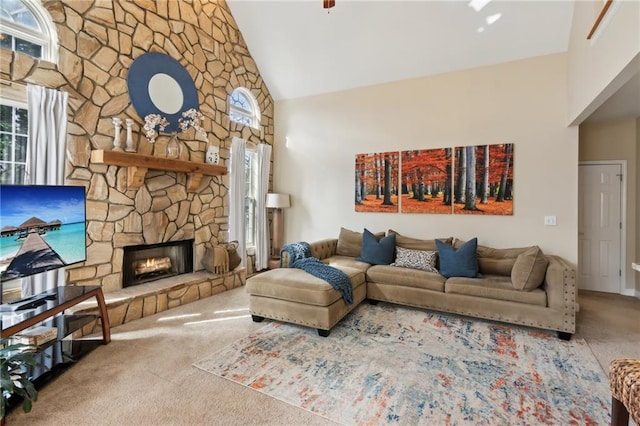 living room with high vaulted ceiling, carpet, and a fireplace