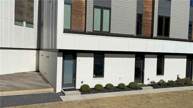 exterior space with brick siding