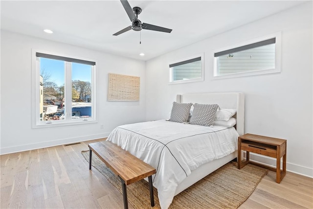 bedroom featuring baseboards, recessed lighting, a ceiling fan, light wood-style floors, and visible vents