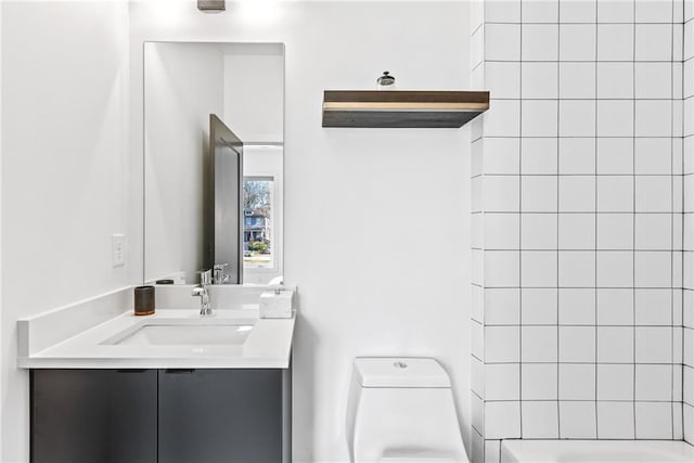 full bathroom with  shower combination, vanity, and toilet