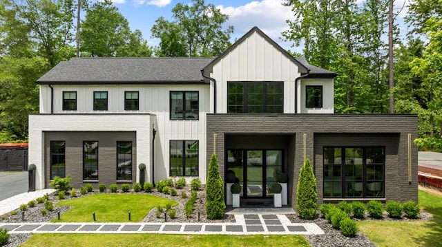 185 Pebble Trl, Alpharetta, GA 30009 - view of front of home with a front yard and board and batten siding