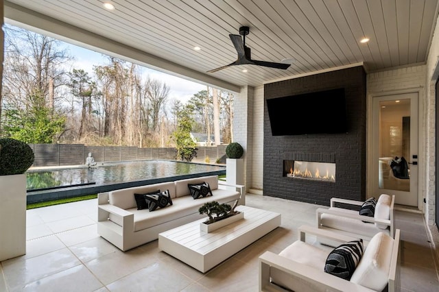 185 Pebble Trl, Alpharetta, GA 30009 - view of patio with a fenced backyard, an outdoor living space with a fireplace, and ceiling fan