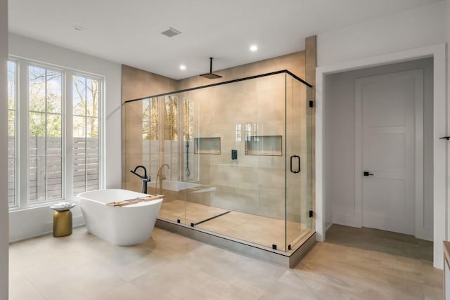 185 Pebble Trl, Alpharetta, GA 30009 - full bath with a stall shower, a freestanding tub, and recessed lighting
