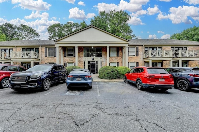 3650 Ashford Dunwoody Rd NE Unit 923, Atlanta, GA 30319 - view of front facade with uncovered parking and brick siding