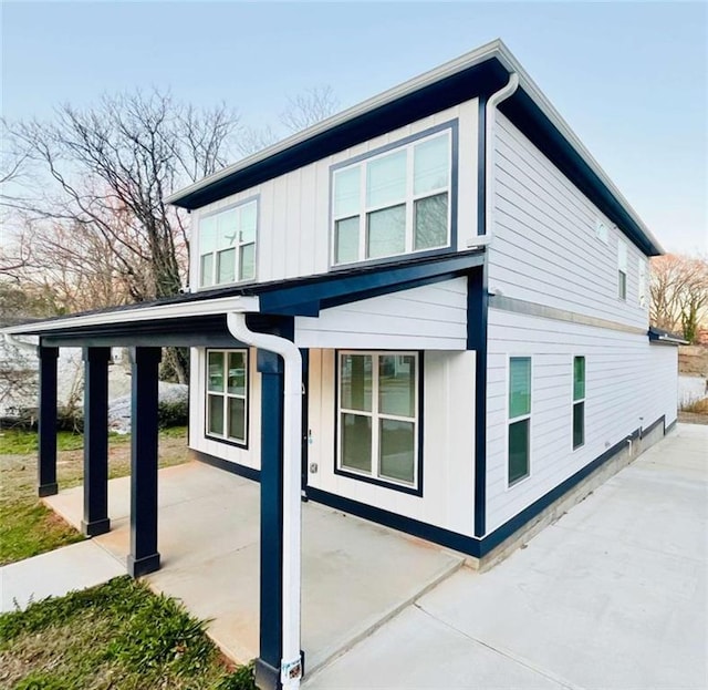 view of property exterior with board and batten siding