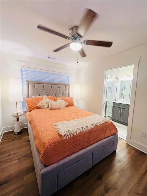 bedroom featuring dark wood-style floors, visible vents, and baseboards